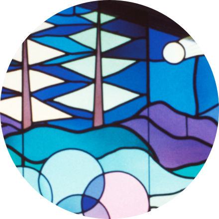 layered orange fused glass disc with bubbles